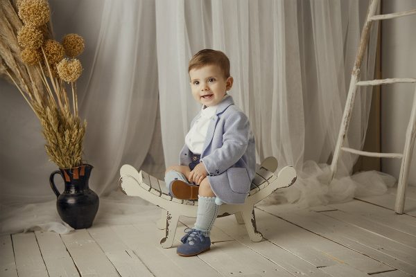 Sin título-13 Fotografía de un niño en un asiento